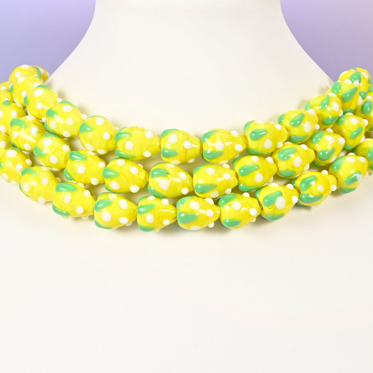Strawberry glass beads, yellow with white dots, approximately 15.5x12mm