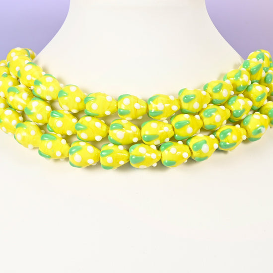 Strawberry glass beads, yellow with white dots, approximately 15.5x12mm