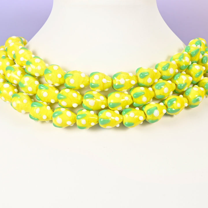 Strawberry glass beads, yellow with white dots, approximately 15.5x12mm