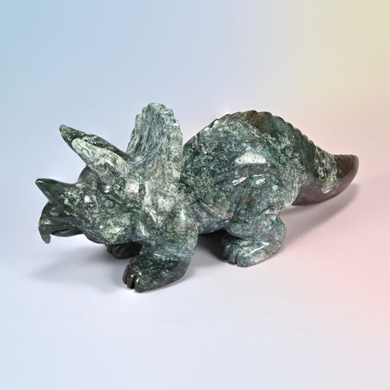 Three-quarter front view of the large natural Indian agate triceratops dinosaur carving