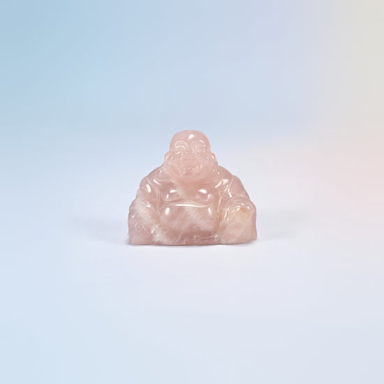 One rose quartz laughing Buddha crystal carving, light pink natural stone