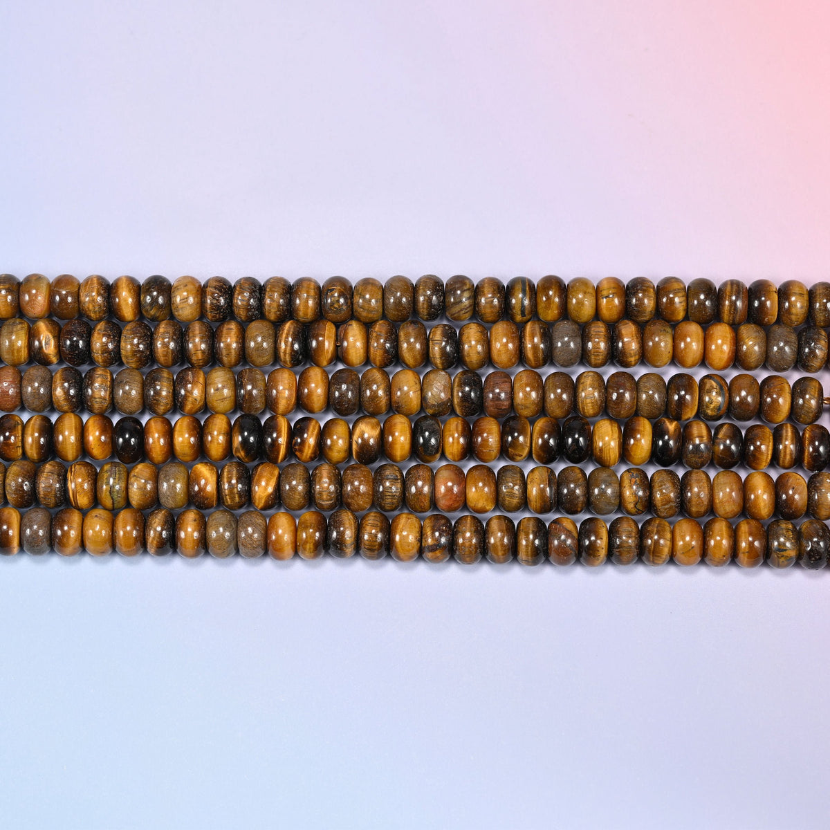 Natural Tiger's Eye Rondelle Beads in rich golden brown and deep chocolate tones.