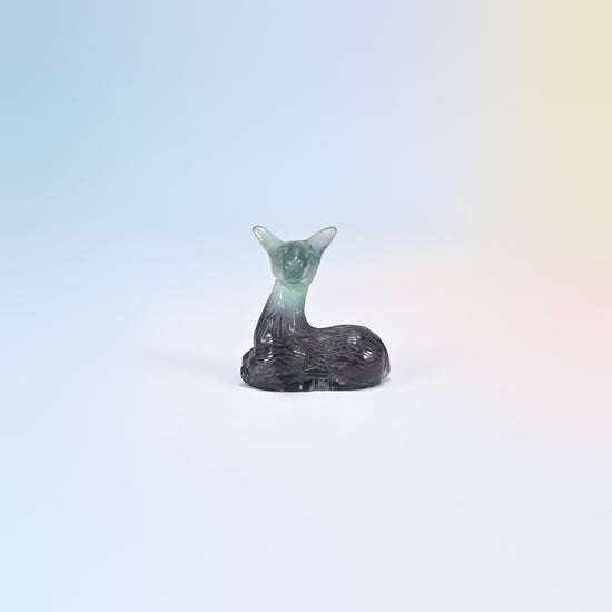 Natural rainbow fluorite deer carving, 2 inch, teal green and dark purple
