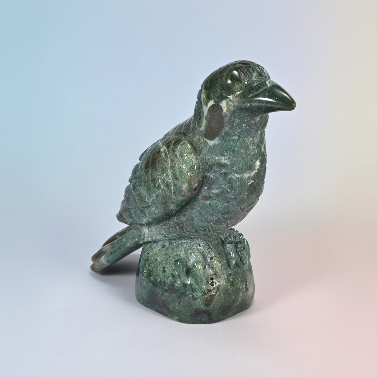 Three-quarter front view of the 5 inch Indian agate crow carving, glossy green stone