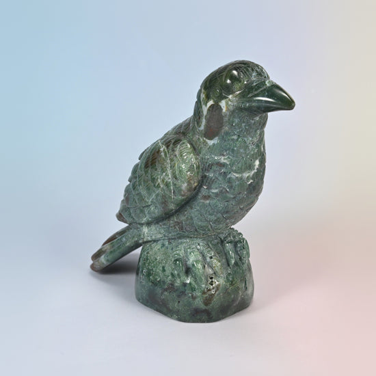 Three-quarter front view of the 5 inch Indian agate crow carving, glossy green stone