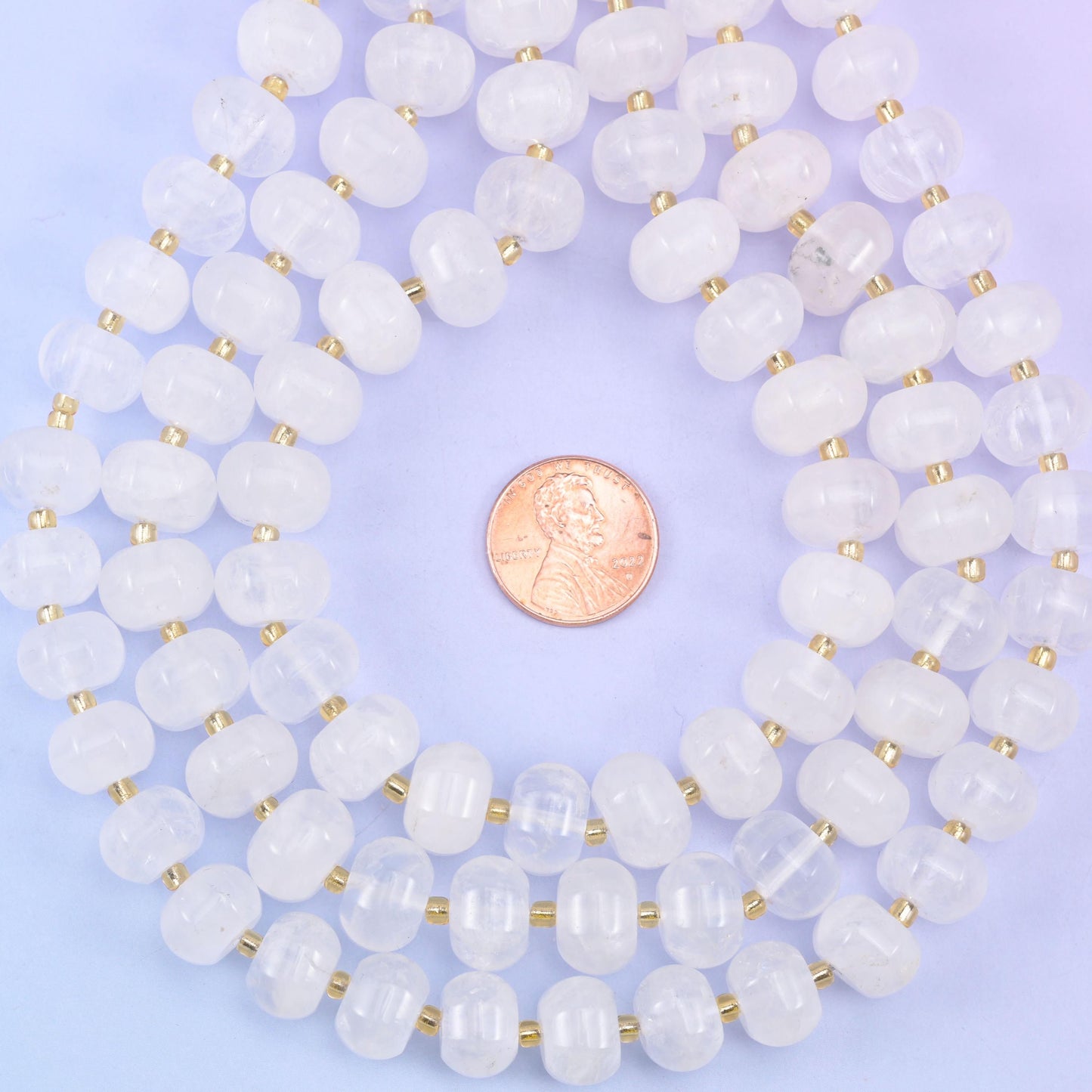 Coiled strands with a penny at the centre for a clear size comparison