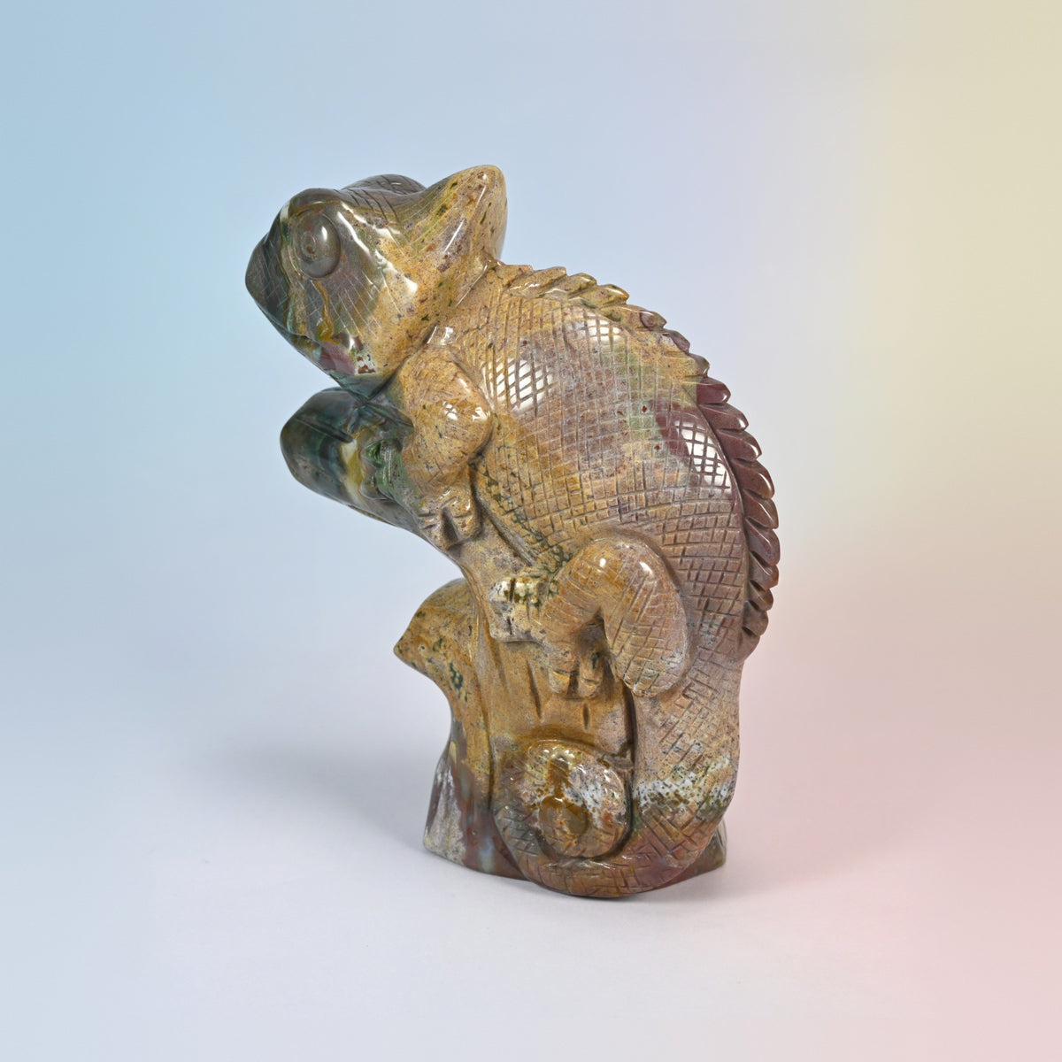 Three-quarter view of the 5.3 inch ocean jasper chameleon, turret eye and spiral tail