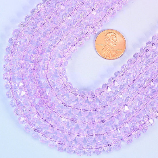 Faceted rondelle cut transparent purple glass beads