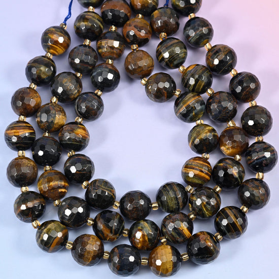 Big, heavy and richly banded, running through near-black steel grey, deep bronze and bright golden brown, with a chatoyant sheen sweeping across the facets.