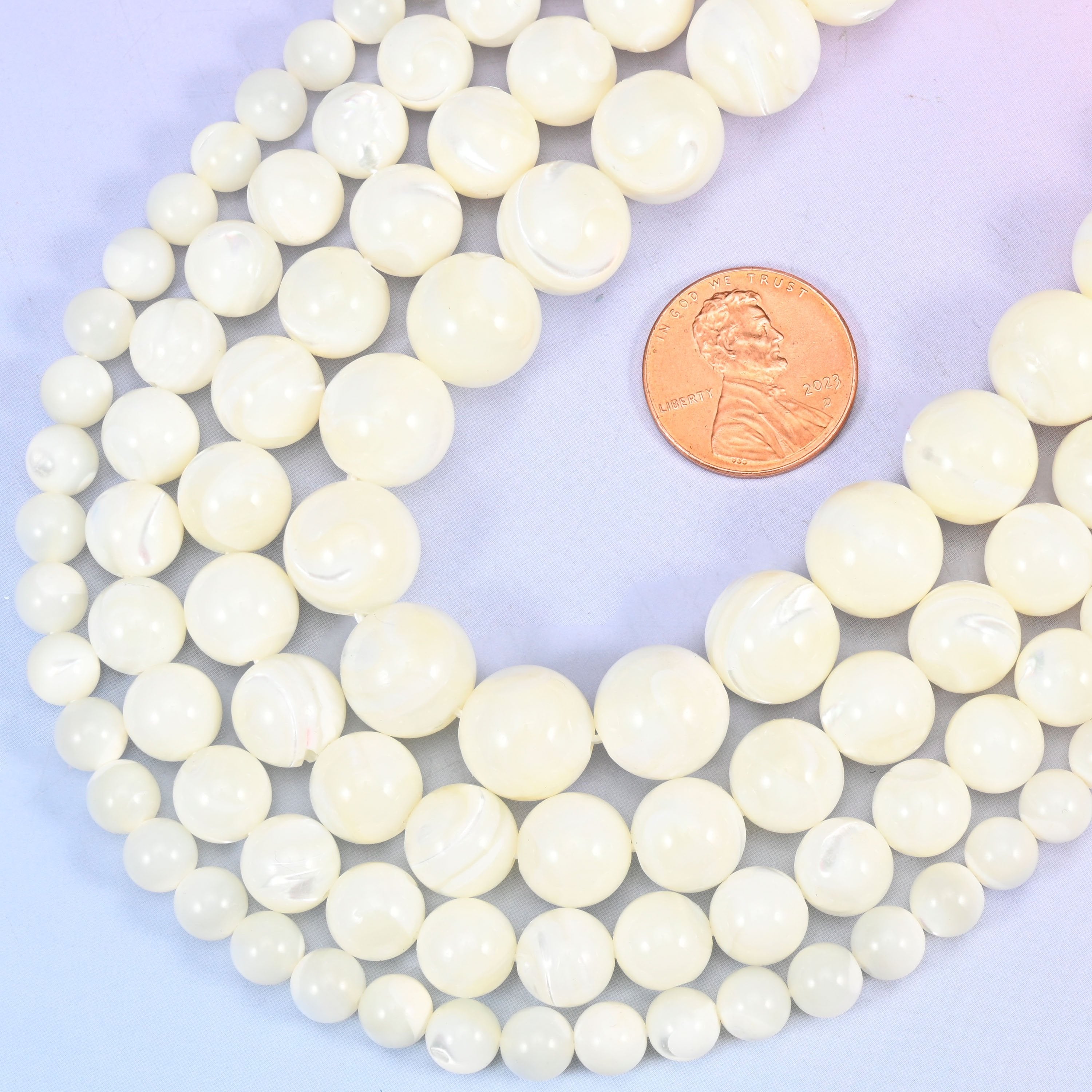Round cut white trochus shell beads