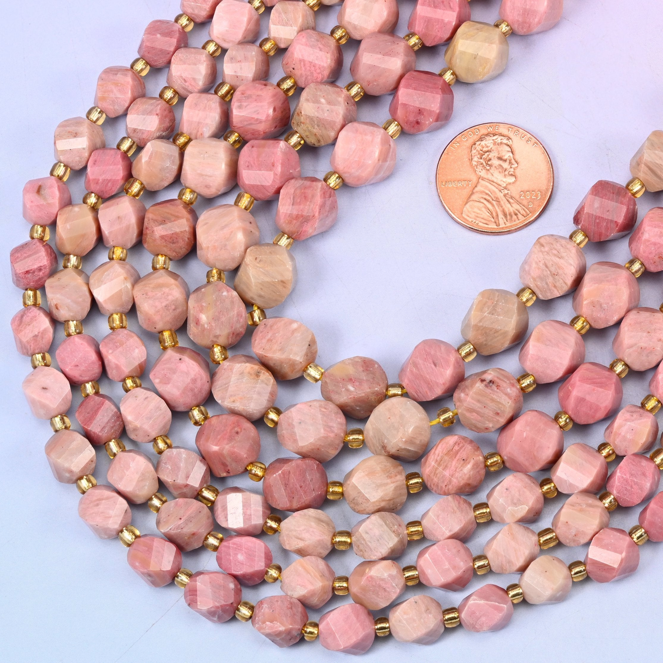 Faceted spiral twist cut natural pink rhodonite beads