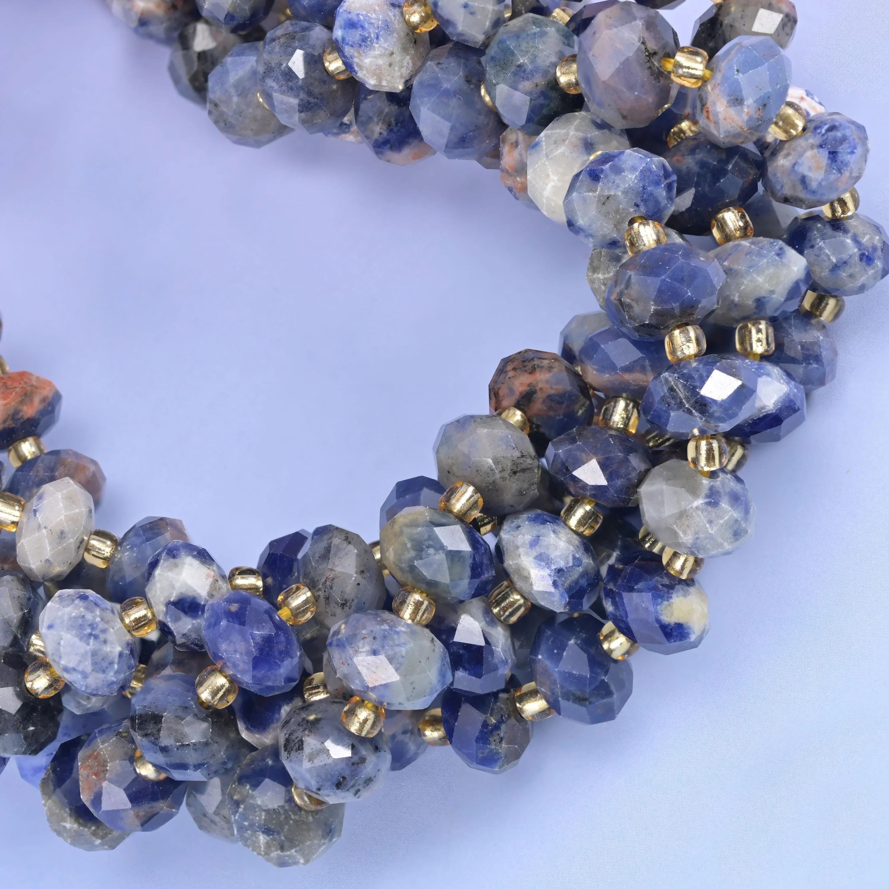 Faceted rondelle cut orange sodalite beads