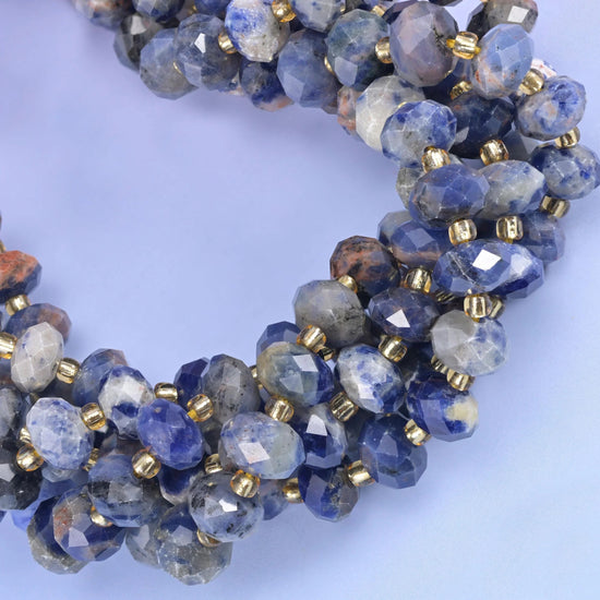 Faceted rondelle cut orange sodalite beads
