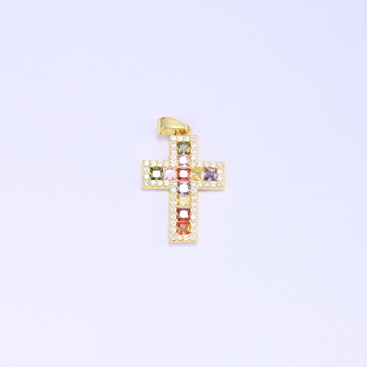 Zirconia cross charm in 18K gold plated brass framed by a border of clear pave stones
