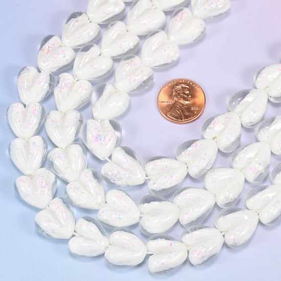 Milky opaque white glass heart beads with soft pearly iridescence