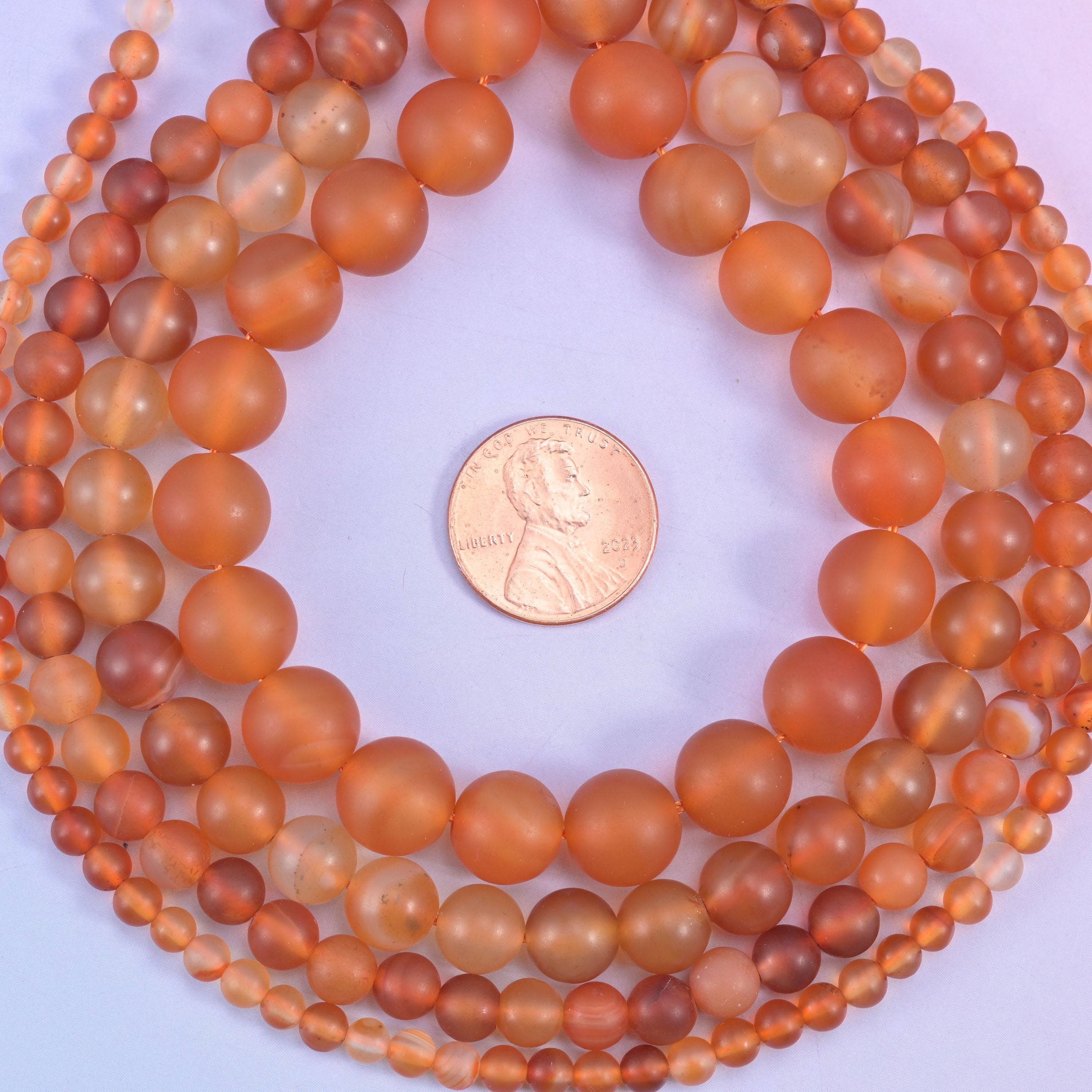 Orange Carnelian Matte Round Beads, warm apricot to deep russet orange with a soft frosted matte surface