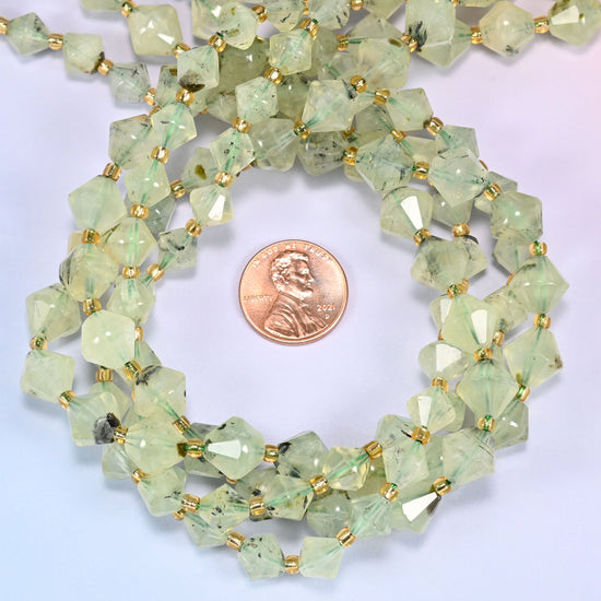Close-up of Green Prehnite faceted bicone beads, 8mm and 10mm, coiled into a circle, highlighting the faceted shape and light green tone.