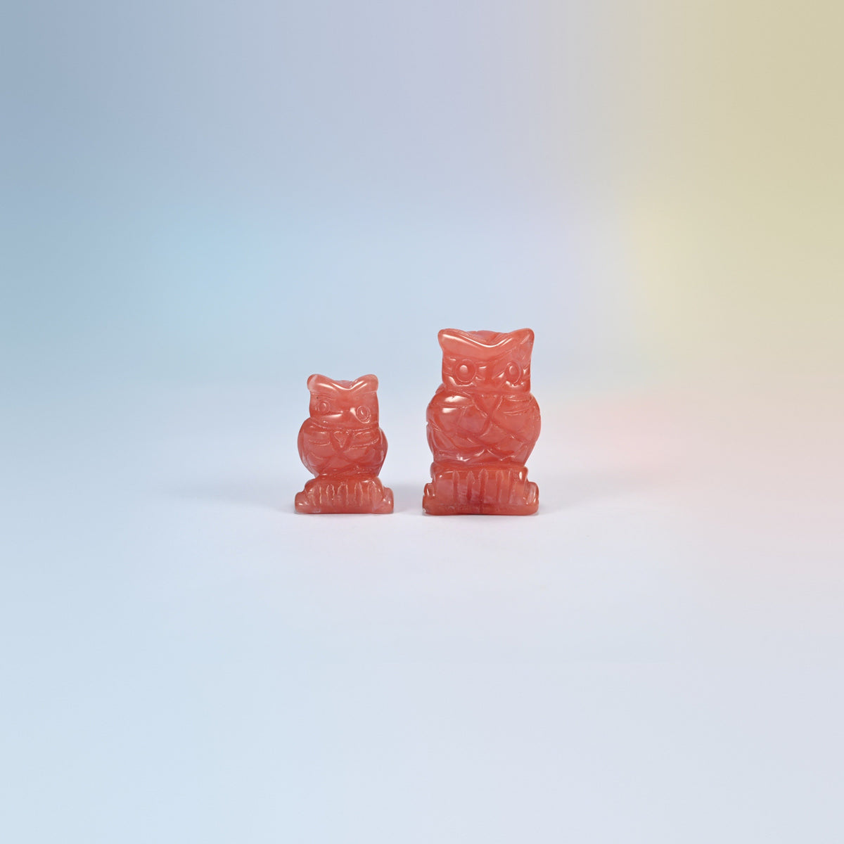 Owl crystal carving in watermelon quartz, pink-red man-made glass