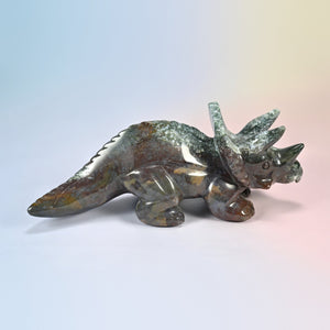 8 inch natural Indian agate triceratops carving, side view with mossy green frill and brown and red body