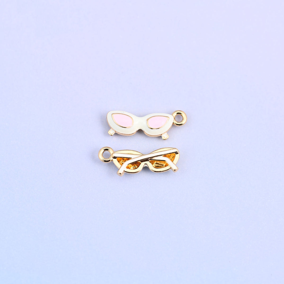 White cat eye sunglasses charm with pink lenses, front and back.