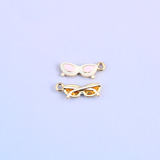 White cat eye sunglasses charm with pink lenses, front and back.