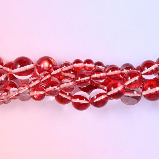 Bright cherry red transparent glass beads with an iridescent stripe