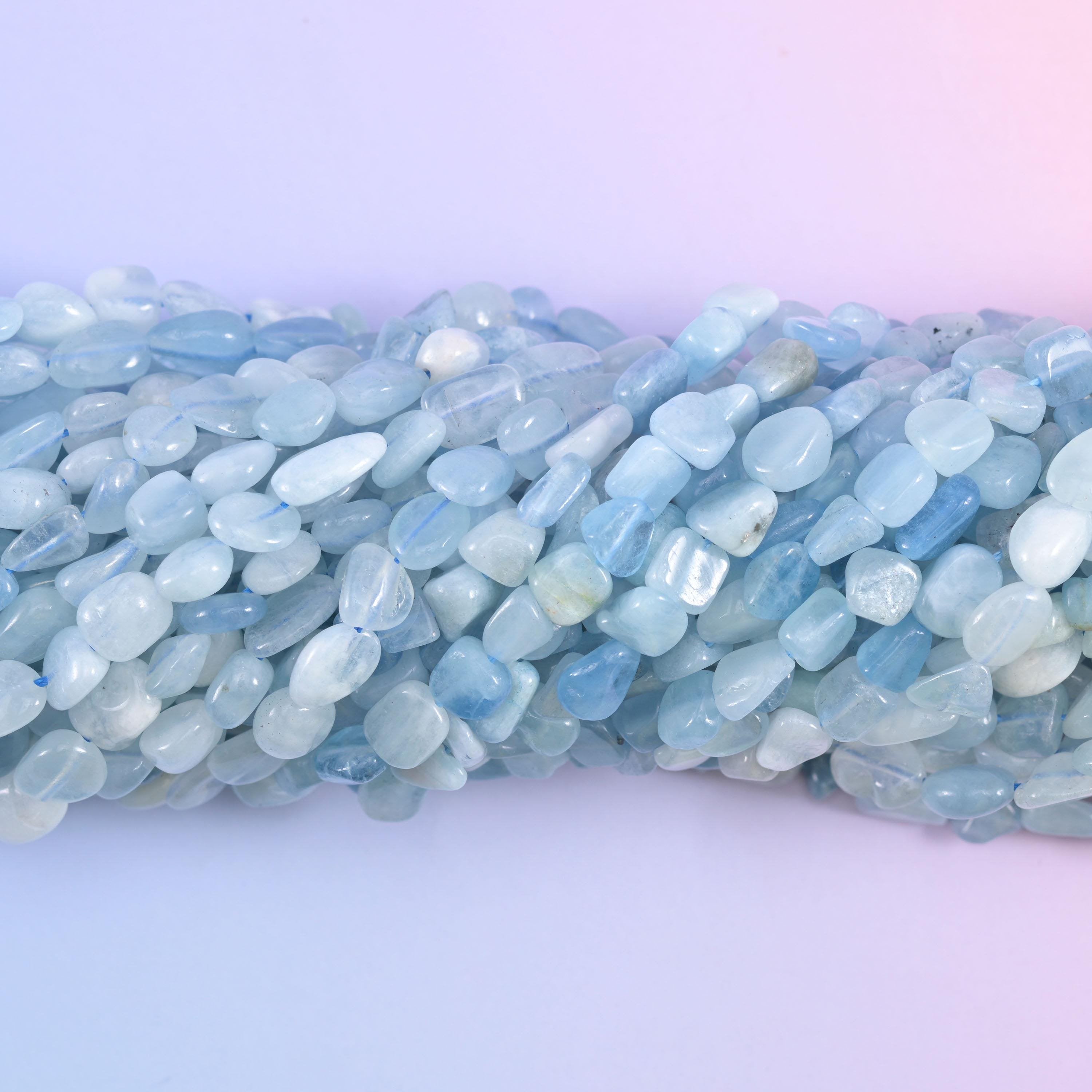 Macro view of translucent aquamarine pebbles with cloudy white inclusions