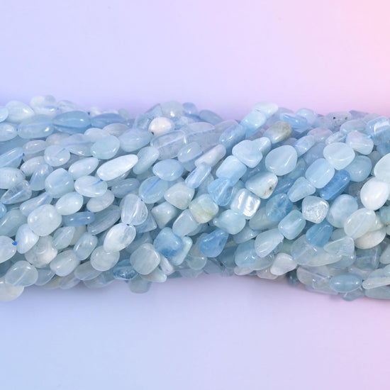 Macro view of translucent aquamarine pebbles with cloudy white inclusions