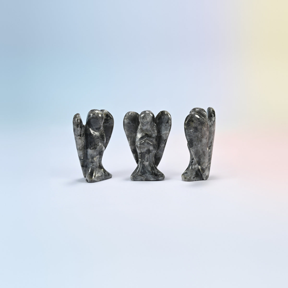 Three natural black labradorite guardian angel carvings, dark gray with silver flecks, 2 inch