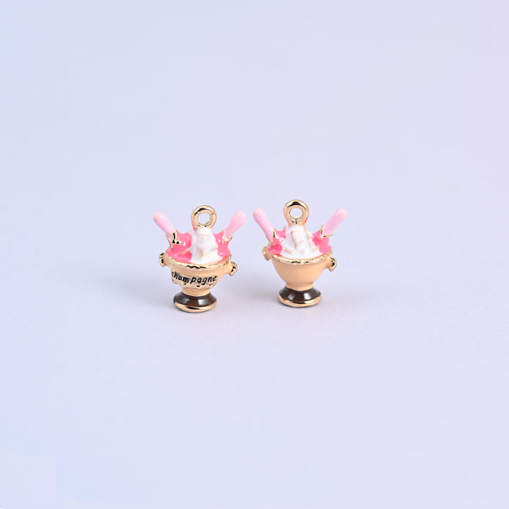 Tan ice cream charm shown front and back, footed sundae coupe with Champagne lettering and a dark brown base.
