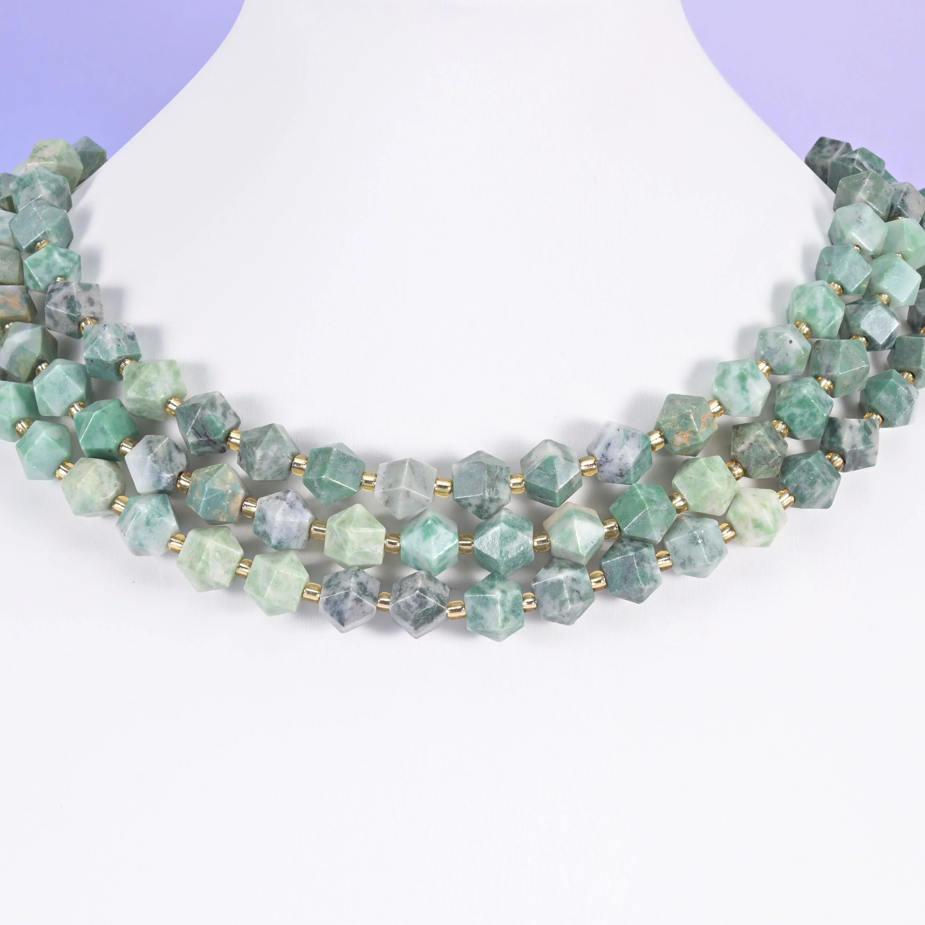Faceted diamond cut gemstone beads, eight flat panels per bead.