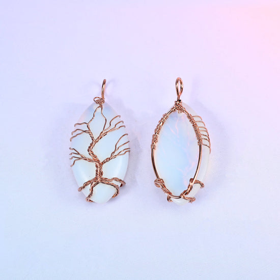 Milky white Oval Crystal Pendant with Copper Wired Tree shown front and back, the reverse crossed by a copper wire frame around the bare oval.