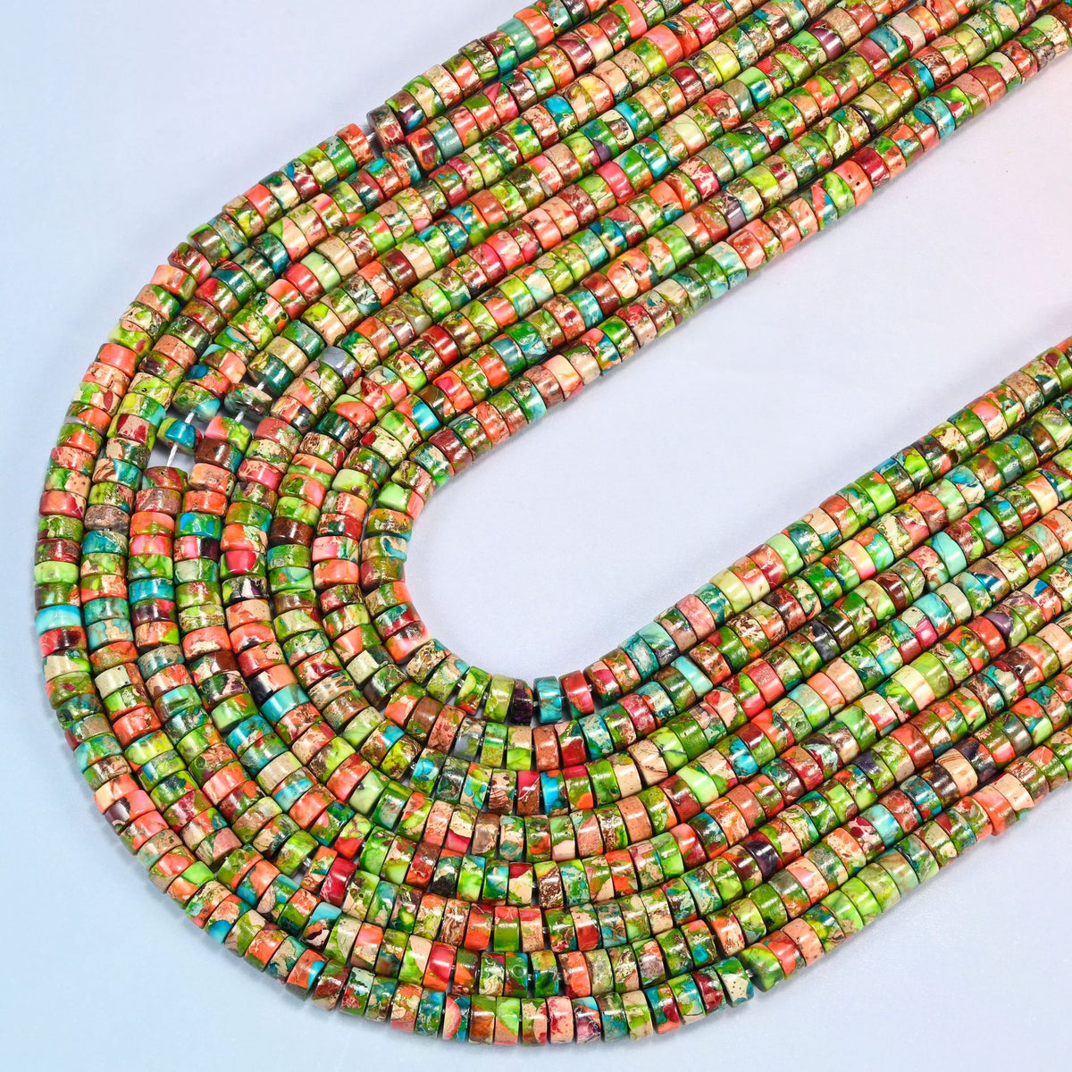 Dyed blue green sea sediment jasper heishi disc beads 2x4mm in several strands curved into a wide U, lime green, coral orange and turquoise marbled discs