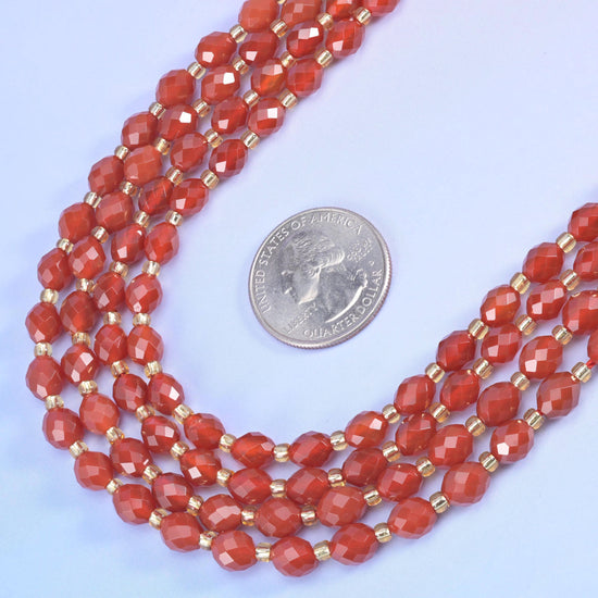 Red Agate Faceted Rice Barrel Beads in warm brick and terracotta