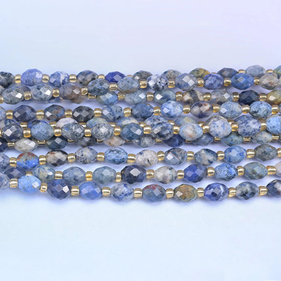 Faceted rice barrel cut sunset dumortierite beads