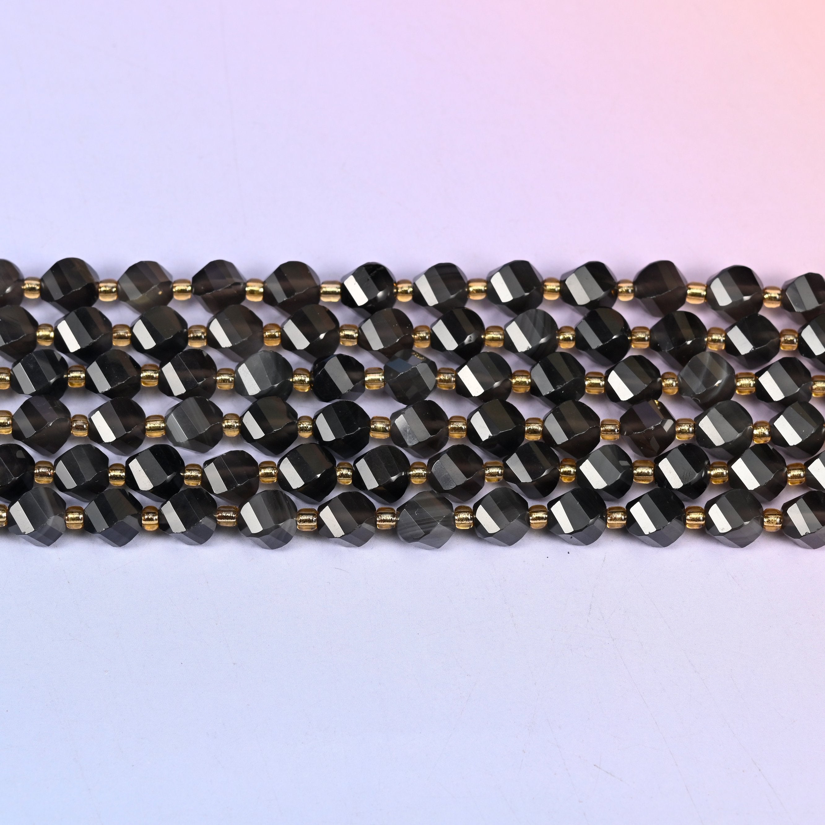 Ice obsidian natural stone beads mixing glassy near-black beads with lighter translucent smoke grey ones