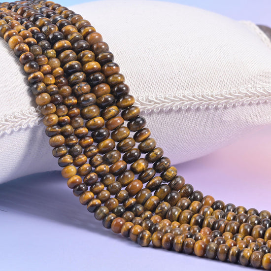 Tiger Eye smooth rondelle beads in deep olive brown and golden amber banding with near-black stripes