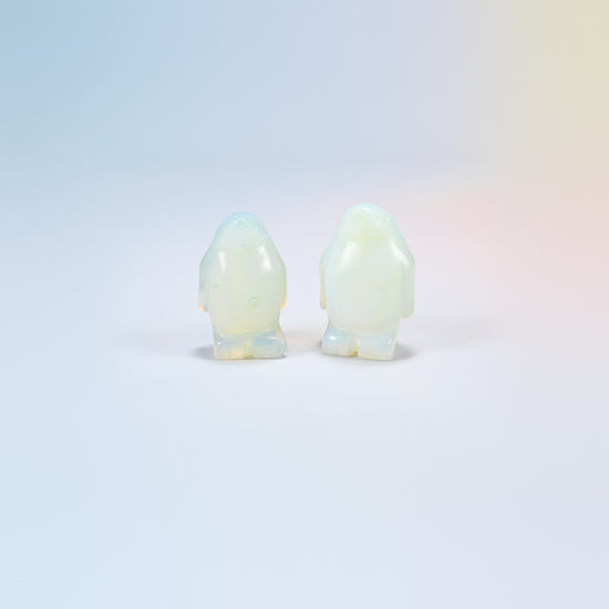 Two opalite penguin crystal carvings, 1.5 inch, glowing milky white man-made glass