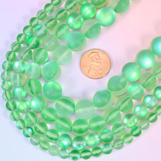 Round frosted green glass beads with sea-glass surface