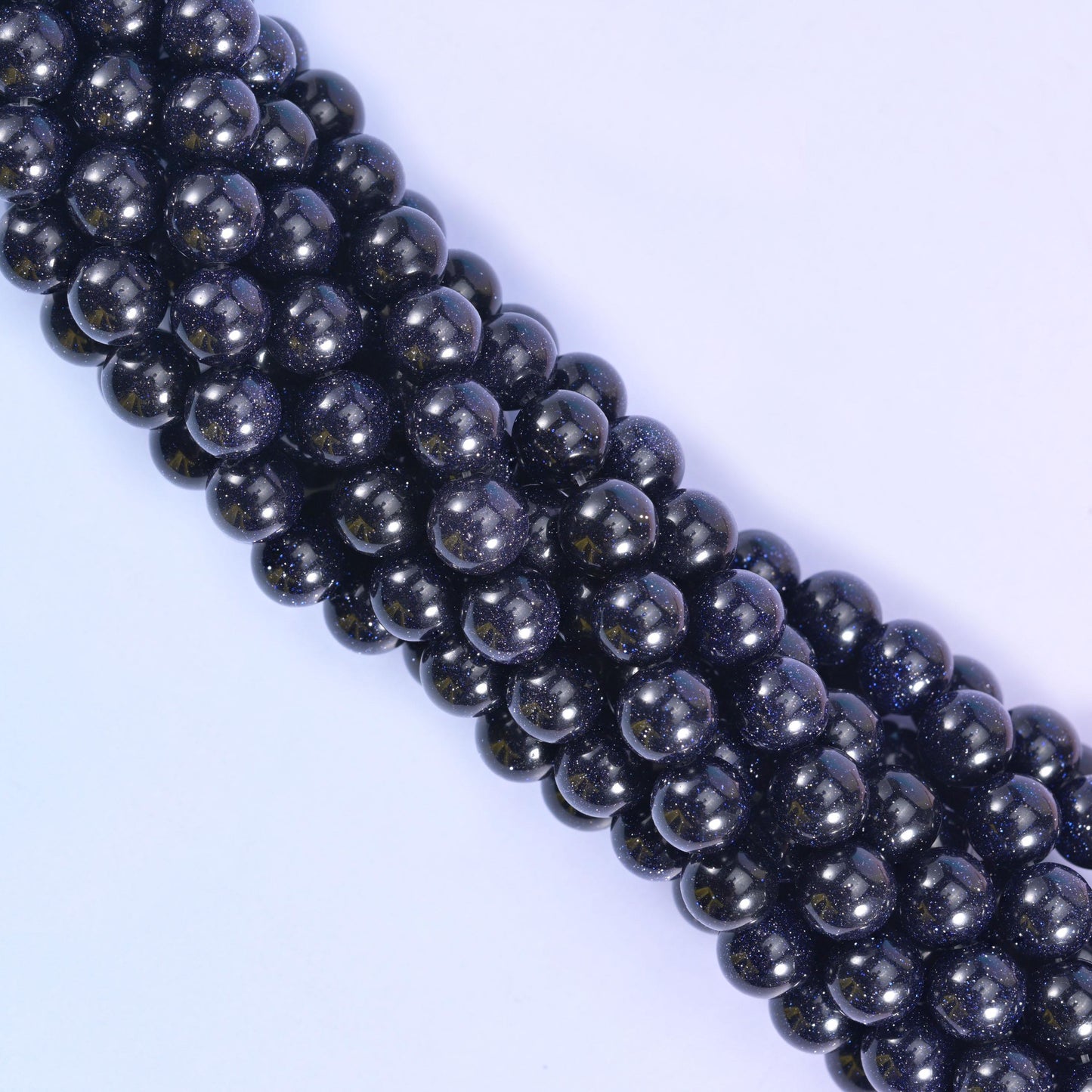 Smooth round cut blue sandstone beads