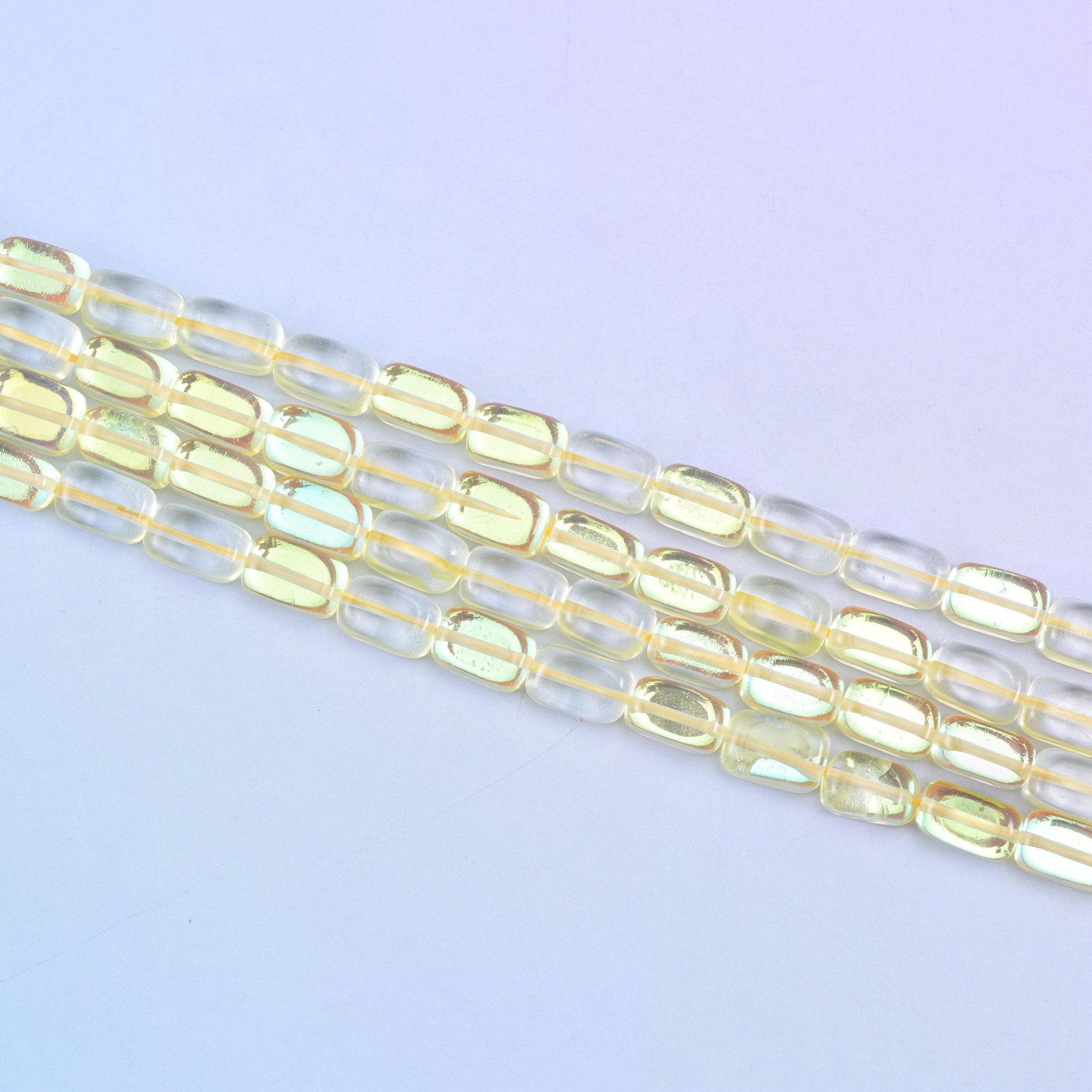 Yellow Mystic Aura glass beads in a sunny golden-yellow shine with a subtle iridescent glow