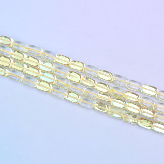 Yellow Mystic Aura glass beads in a sunny golden-yellow shine with a subtle iridescent glow