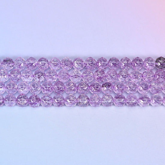 Transparent purple faceted round glass beads in clear lilac-violet