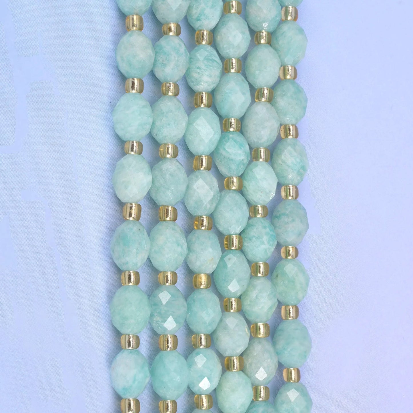 Faceted rice barrel cut green amazonite beads