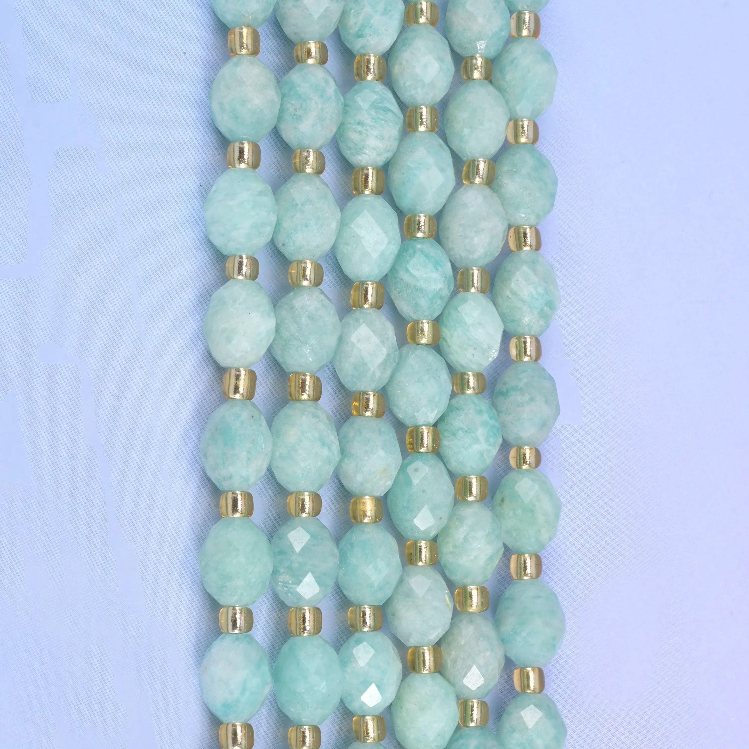 Faceted rice barrel cut green amazonite beads