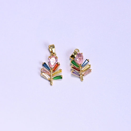 Leaf charm with multicolor baguette zircon veins fanning along a gold stem
