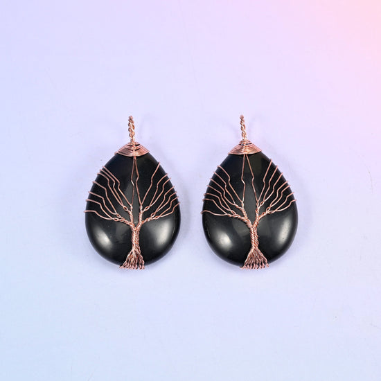 Teardrop Crystal Pendant with Copper Wired Tree in black obsidian, a matched pair where the copper branches stand out sharply against the glossy black.