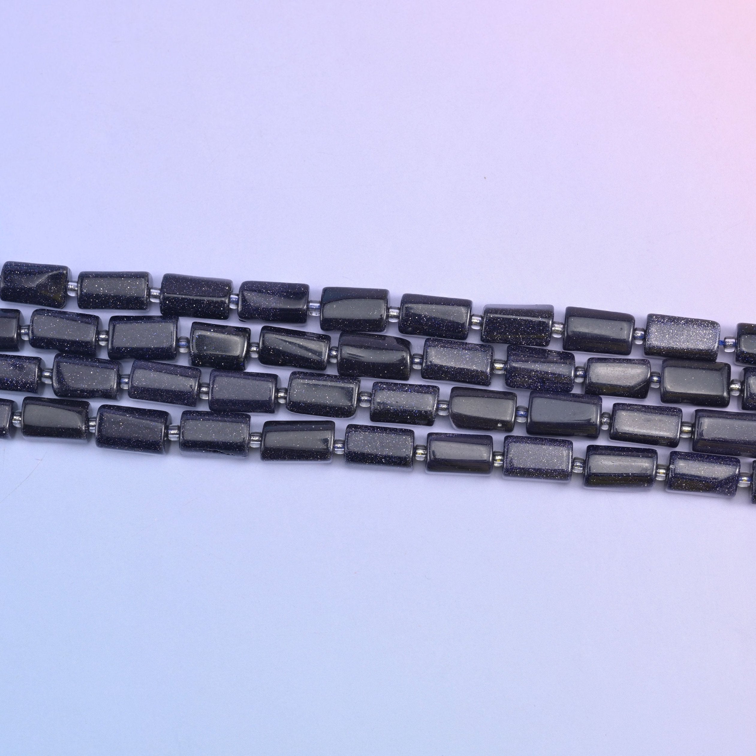 Blue Sandstone Faceted Tube Beads 12x8mm in deep sparkling blue