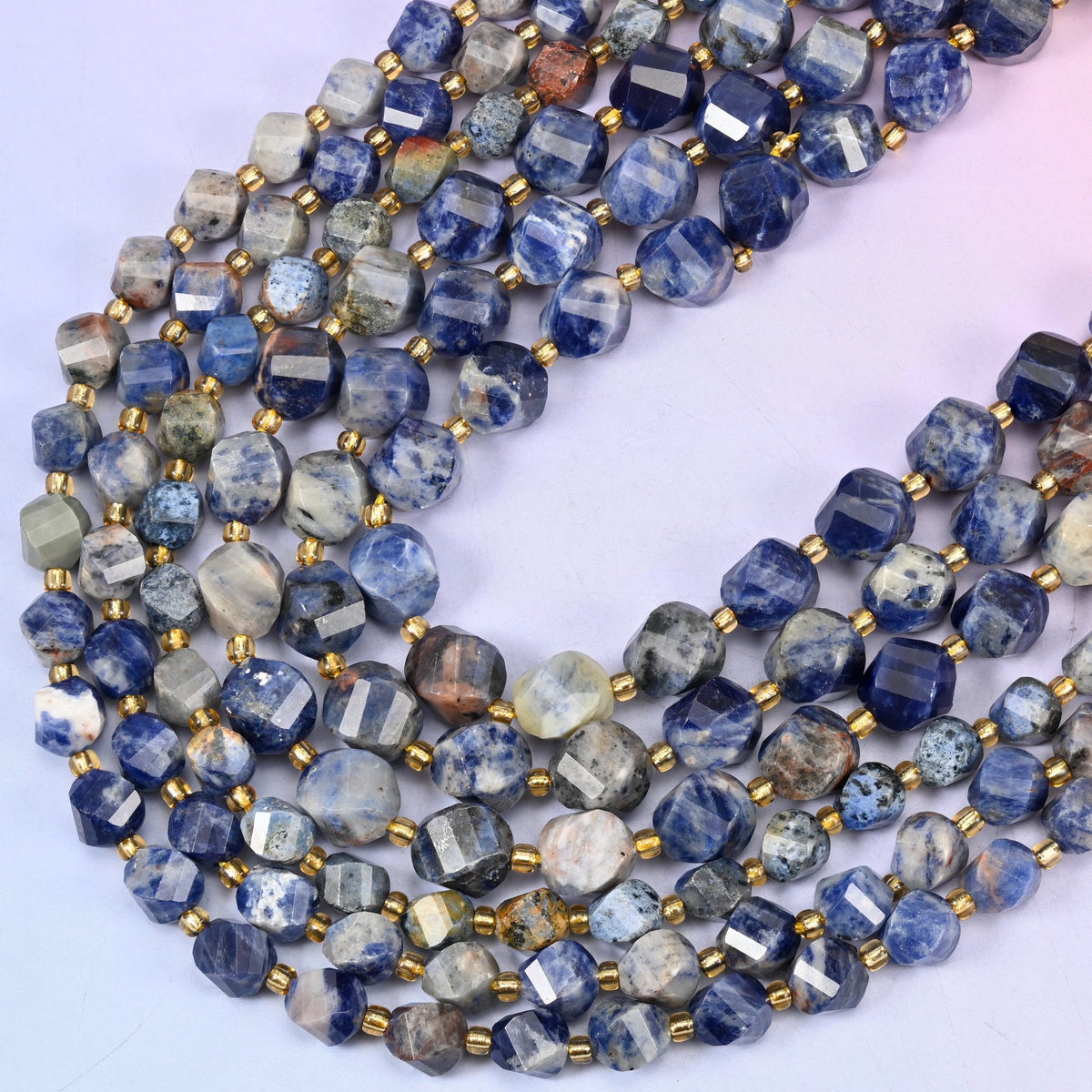Orange Sodalite faceted spiral twist beads, 15 inch strand