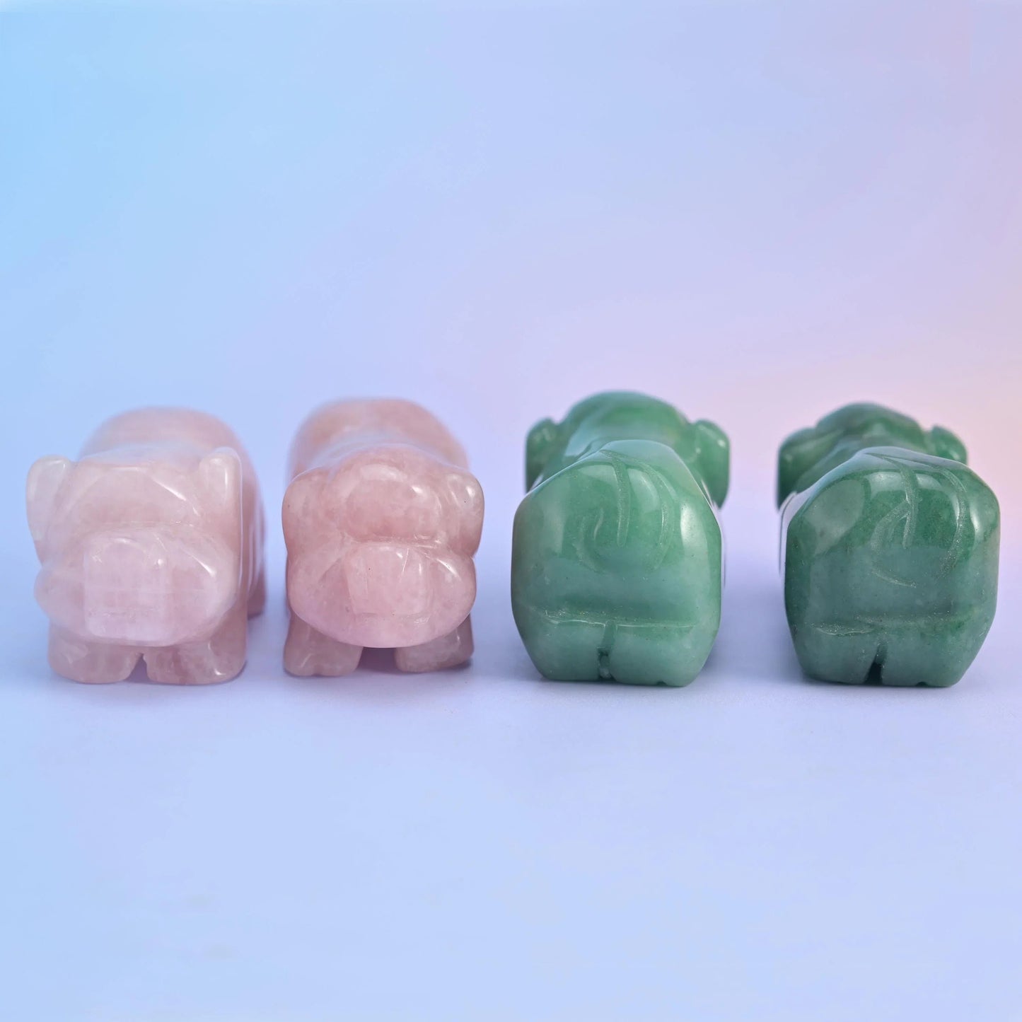 Rose Quartz pig figurine in soft blush pink tones.